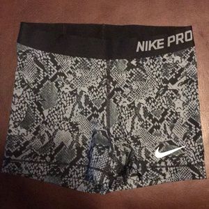 Grey patterned Nike Pro Compact shorts